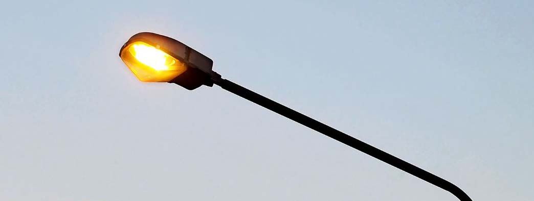  A photo of a street light at sunset.